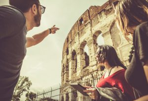 Tourists with a guide in front of the Coliseum, Rome